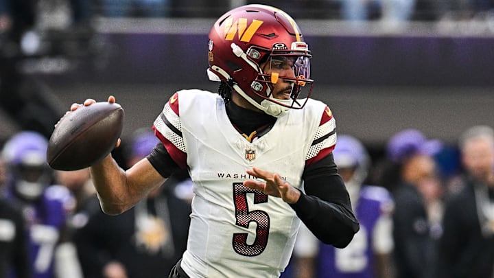 Dec 7, 2025; Minneapolis, Minnesota, USA; Washington Commanders quarterback Jayden Daniels (5) drops back to pass against the Minnesota Vikings during the first half at U.S. Bank Stadium. Mandatory Credit: Jeffrey Becker-Imagn Images