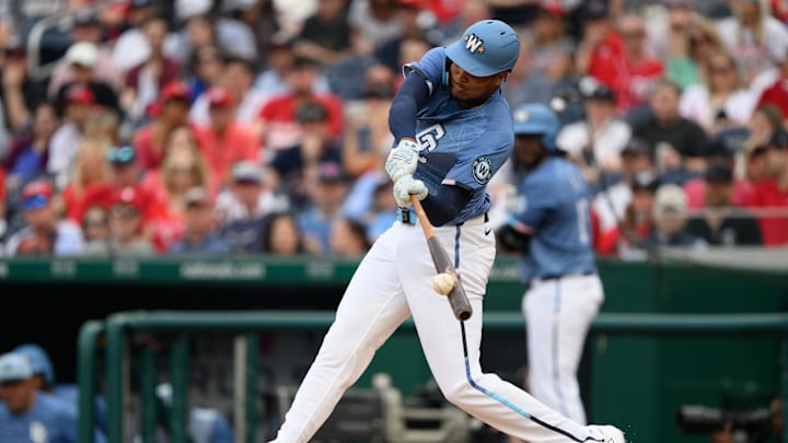 Mar 29, 2025; Washington, District of Columbia, USA; Washington Nationals outfielder James Wood (29) hits a double during the fifth inning against the Philadelphia Phillies at Nationals Park. 