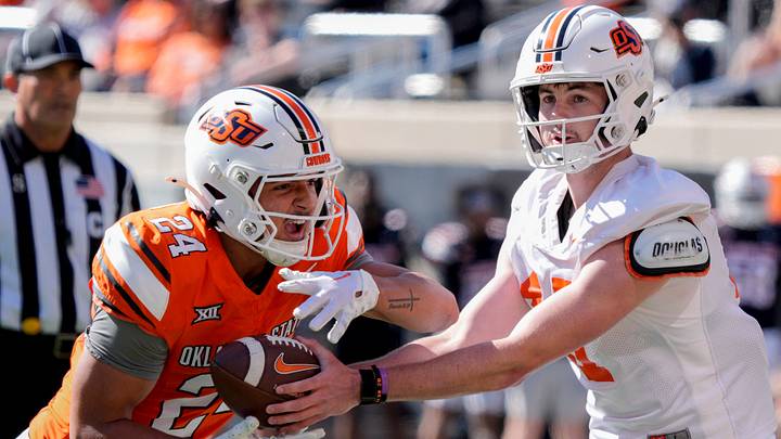 Oklahoma State's Drew Mestemaker hands off to Caleb Hawkins. Oklahoma State's Drew Mestemaker hands off to Caleb Hawkins.