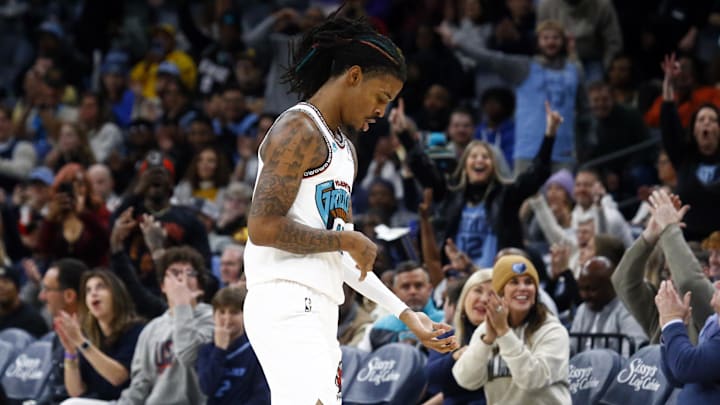Dec 1, 2024; Memphis, Tennessee, USA; Memphis Grizzlies guard Ja Morant (12) reacts during the third quarter against the Indiana Pacers at FedExForum. Mandatory Credit: Petre Thomas-Imagn Images