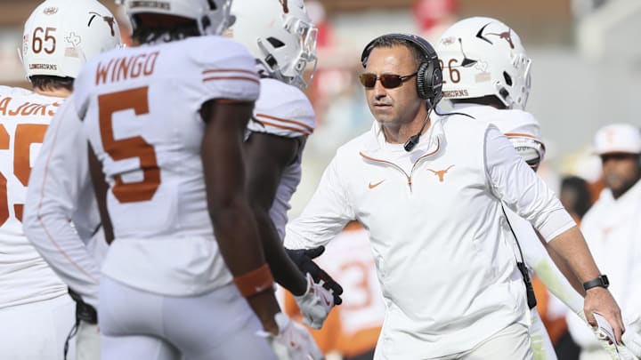 Nov 16, 2024; Fayetteville, Arkansas, USA; Texas Longhorns head coach Steve Sarkisian celebrates after a score in the fourth quarter against the Arkansas Razorbacks at Donald W. Reynolds Razorback Stadium. Texas won 20-10. Mandatory Credit: Nelson Chenault-Imagn Images