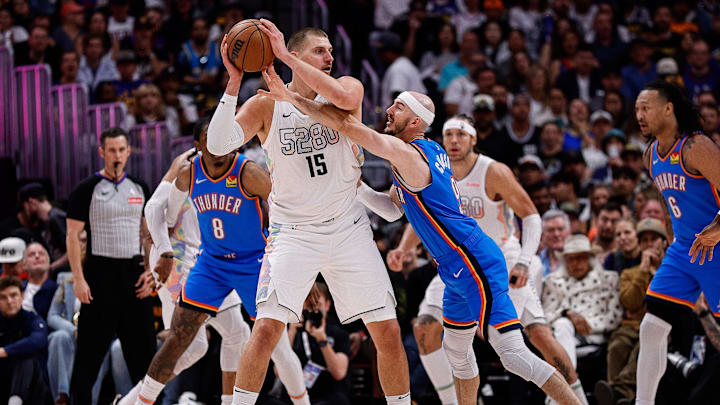 May 15, 2025; Denver, Colorado, USA; Denver Nuggets center Nikola Jokic (15) controls the ball under pressure from Oklahoma City Thunder guard Alex Caruso (9) in the second quarter during Game 6 of the second round at Ball Arena. Mandatory Credit: Isaiah J. Downing-Imagn Images May 15, 2025; Denver, Colorado, USA; Denver Nuggets center Nikola Jokic (15) controls the ball under pressure from Oklahoma City Thunder guard Alex Caruso (9) in the second quarter during Game 6 of the second round at Ball Arena. Mandatory Credit: Isaiah J. Downing-Imagn Images