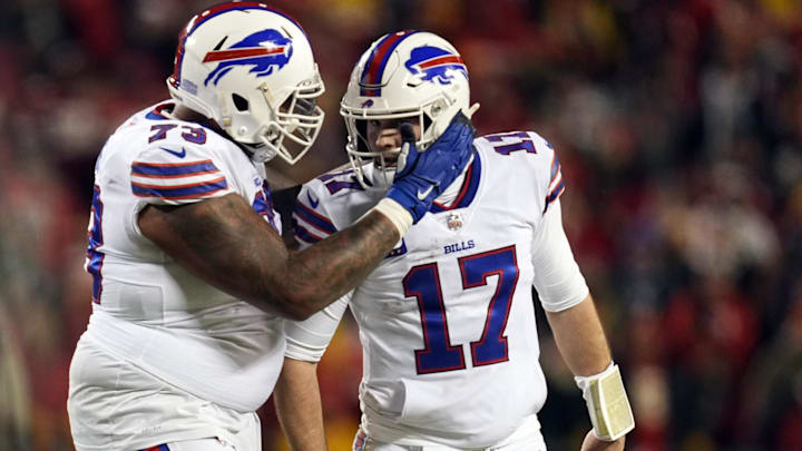 Jan 23, 2022; Kansas City, Missouri, USA; Buffalo Bills quarterback Josh Allen (17) celebrates offensive tackle Dion Dawkins (73) 
