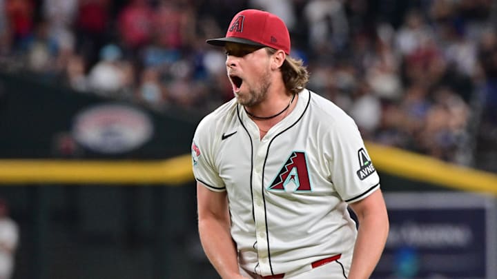 Sep 25, 2024; Phoenix, Arizona, USA; Arizona Diamondbacks pitcher Kevin Ginkel (37) celebrates after beating the San Francisco Giants at Chase Field. Mandatory Credit: Matt Kartozian-Imagn Images