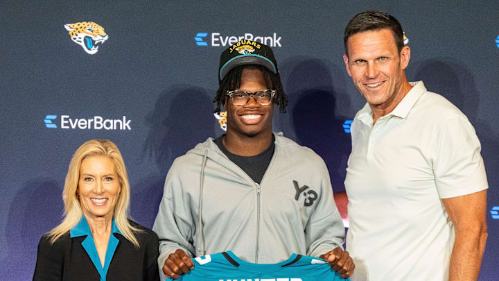 The Jacksonville Jaguars’ first-round pick, Colorado Buffaloes wide receiver and defensive back Travis Hunter, center, poses with his jersey with Tony Boselli, Executive Vice President of Football Operations, right and Jacksonville Mayor Donna Deegan, left, during a press conference Friday, April 25, 2025, at Miller Electric Center in Jacksonville, Fla. [Doug Engle/Florida Times-Union]