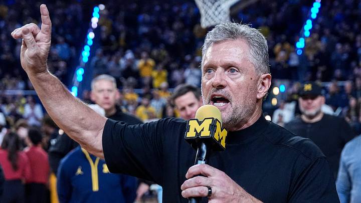 Michigan football head coach Kyle Whittingham speaks as he is being introduced on the floor during the first half between Michigan and USC at Crisler Center in Ann Arbor on Friday, Jan. 2, 2026.