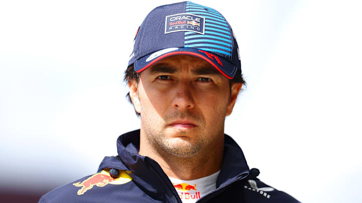 19th placed qualifier Sergio Perez of Mexico and Oracle Red Bull Racing walks in the Pitlane during qualifying ahead of the F1 Grand Prix of Great Britain at Silverstone Circuit on July 06, 2024 in Northampton, England.