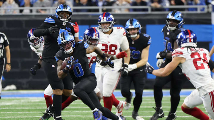 Nov 23, 2025; Detroit, Michigan, USA; Detroit Lions running back Jahmyr Gibbs (0) runs with the ball in the fourth quarter against the New York Giants at Ford Field.  