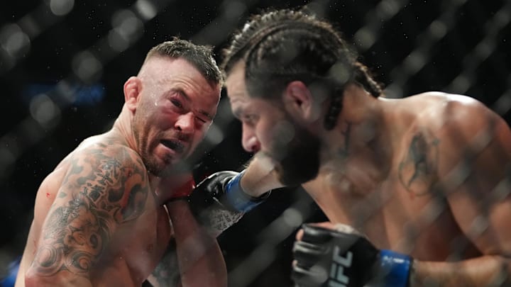 Mar 5, 2022; Las Vegas, Nevada, UNITED STATES; Colby Covington (red gloves) fights Jorge Masvidal