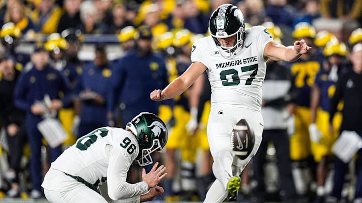 Michigan State place kicker Jonathan Kim (97) attempts a field goal against Michigan during the first half at Michigan Stadium in Ann Arbor on Saturday, Oct. 26, 2024.