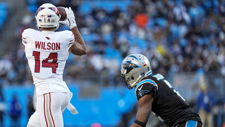 Dec 22, 2024; Charlotte, North Carolina, USA; Arizona Cardinals wide receiver Michael Wilson (14) jumps for a reception defended by Carolina Panthers cornerback Dane Jackson (23) during the second half at Bank of America Stadium. Mandatory Credit: Jim Dedmon-Imagn Images Dec 22, 2024; Charlotte, North Carolina, USA; Arizona Cardinals wide receiver Michael Wilson (14) jumps for a reception defended by Carolina Panthers cornerback Dane Jackson (23) during the second half at Bank of America Stadium. Mandatory Credit: Jim Dedmon-Imagn Images