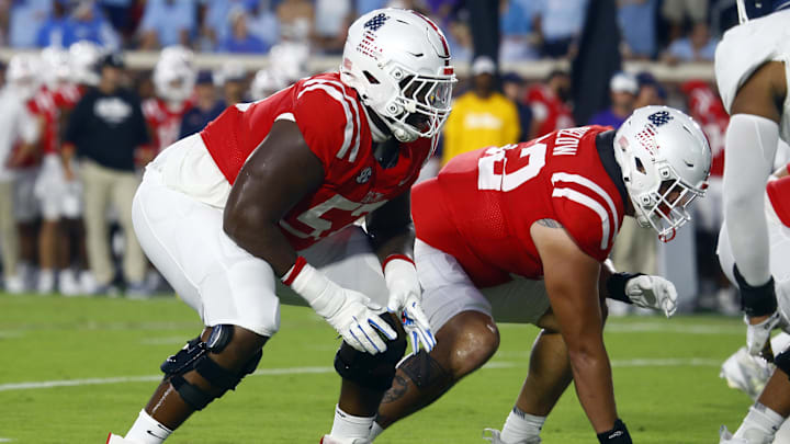 Sep 21, 2024; Oxford, Mississippi, USA; Mississippi Rebels offensive linemen Micah Pettus (57) and Julius Buelow (52) line up before the snap during the first half against the Georgia Southern Eagles at Vaught-Hemingway Stadium. Mandatory Credit: Petre Thomas-Imagn Images