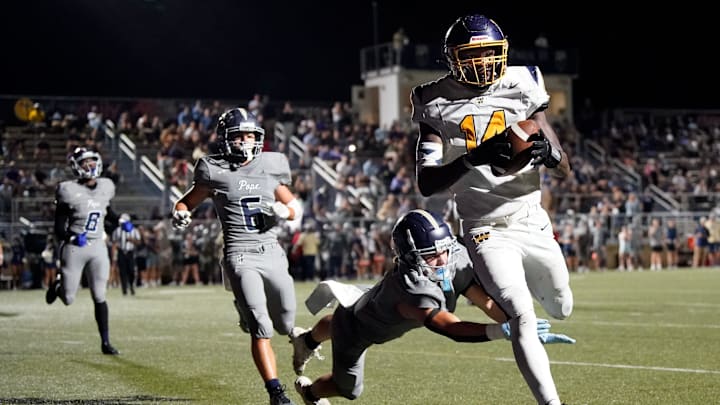 Webb’s Joel Wyatt (14) runs in a touchdown past Pope John Paul II's Reece Reynolds (15) during the second half at Pope Saint John Paul II Preparatory School in Hendersonville, Tenn., Friday, Sept. 13, 2024.