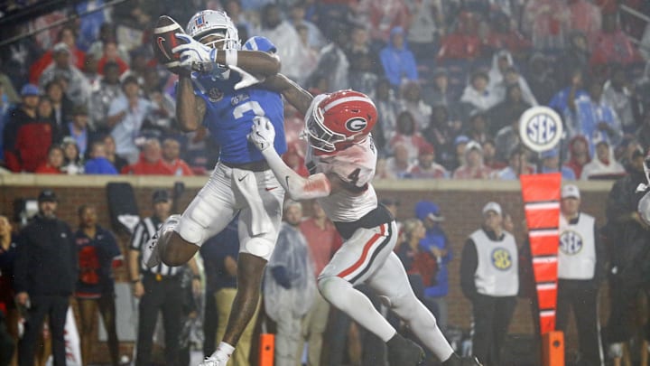 Nov 9, 2024; Oxford, Mississippi, USA; Mississippi Rebels wide receiver Antwane Wells Jr. (3) catches the ball for a touchdown over Georgia Bulldogs defensive back KJ Bolden (4) during the second half  at Vaught-Hemingway Stadium. Mandatory Credit: Petre Thomas-Imagn Images