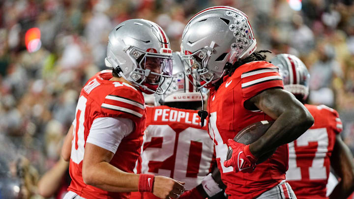 Ohio State Buckeyes quarterback Julian Sayin (10) celebrates a touchdown by wide receiver Jeremiah Smith (4) during the second half of the NCAA football game against the Ohio Bobcats at Ohio Stadium on Sept. 13, 2025. Ohio State won 37-9. Ohio State Buckeyes quarterback Julian Sayin (10) celebrates a touchdown by wide receiver Jeremiah Smith (4) during the second half of the NCAA football game against the Ohio Bobcats at Ohio Stadium on Sept. 13, 2025. Ohio State won 37-9.
