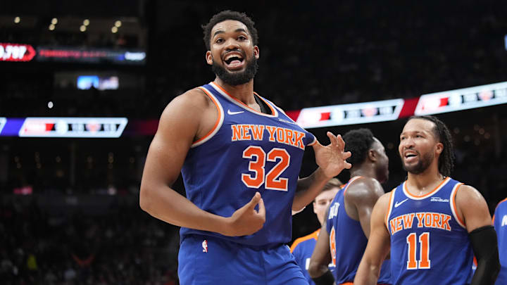 New York  Knicks guard Jalen Brunson watches as center Karl-Anthony Towns celebrate after a basket.