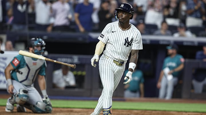 Jul 9, 2025; Bronx, New York, USA;  New York Yankees second baseman Jazz Chisholm Jr. (13) hits a two run home run in the fifth inning against the Seattle Mariners at Yankee Stadium. Mandatory Credit: Wendell Cruz-Imagn Images