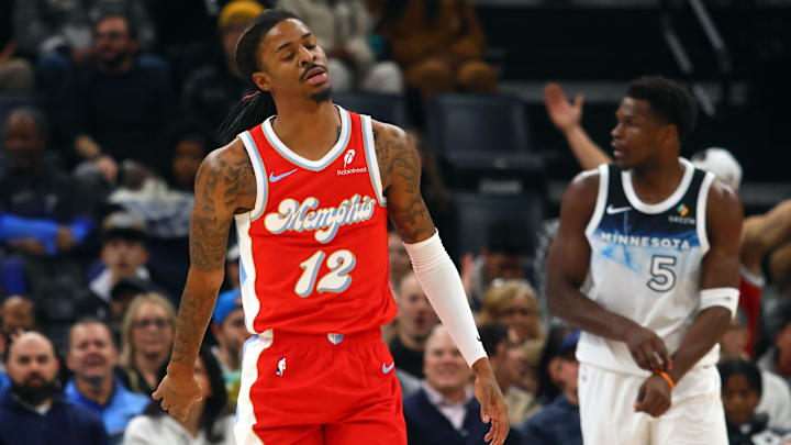 Jan 20, 2025; Memphis, Tennessee, USA; Memphis Grizzlies guard Ja Morant (12) reacts during the second quarter against the Minnesota Timberwolves at FedExForum.
