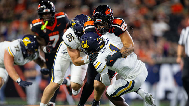 Oregon State's Nikko Taylor tackles California's Kendrick Raphael during an NCAA football game against California at Reser Stadium on Saturday, Aug. 30, 2025, in Corvallis, Ore.