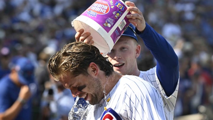 Jul 21, 2024; Chicago, Illinois, USA; Chicago Cubs second base Nico Hoerner (2) is is doused by outfielder Pete Crow-Armstrong (52) after a bases loaded walk to beat the Arizona Diamondbacks in extra innings at Wrigley Field. Jul 21, 2024; Chicago, Illinois, USA; Chicago Cubs second base Nico Hoerner (2) is is doused by outfielder Pete Crow-Armstrong (52) after a bases loaded walk to beat the Arizona Diamondbacks in extra innings at Wrigley Field.