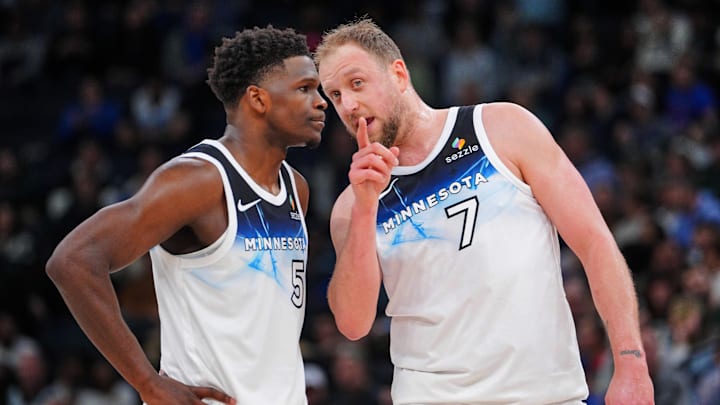 Feb 12, 2025; Minneapolis, Minnesota, USA; Minnesota Timberwolves guard Anthony Edwards (5) and guard Joe Ingles (7) talk during a free throw against the Milwaukee Bucks in the second quarter at Target Center.