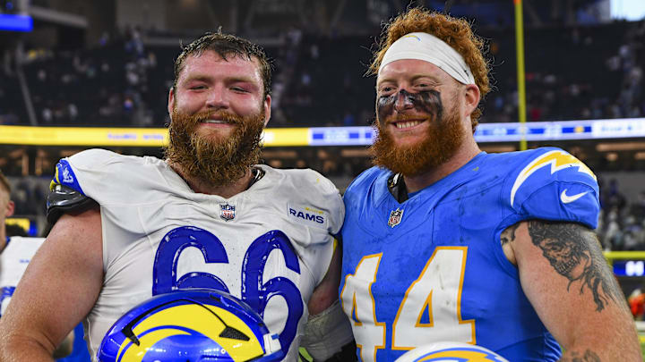 Aug 16, 2025; Inglewood, California, USA; Los Angeles Rams offensive tackle Ben Dooley (66) and Los Angeles Chargers fullback Scott Matlock (44) after the game at SoFi Stadium. Mandatory Credit: Jonathan Hui-Imagn Images