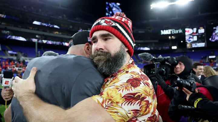 Travis Kelce #87 of the Kansas City Chiefs celebrates with his brother Jason Kelce after a 17-10 victory against the Baltimore Ravens in the AFC Championship Game at M&T Bank Stadium on January 28, 2024 in Baltimore, Maryland. 