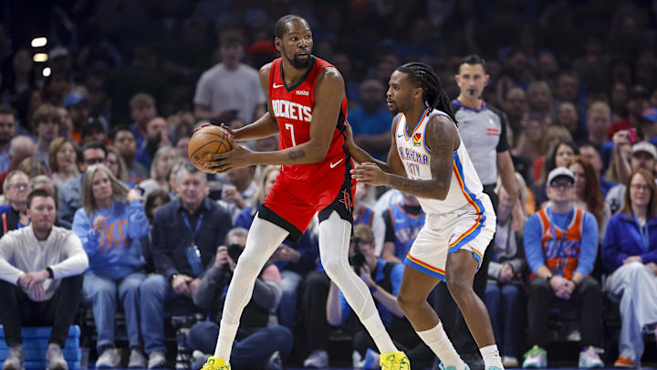 Feb 7, 2026; Oklahoma City, Oklahoma, USA; Houston Rockets forward Kevin Durant (7) moves the ball as Oklahoma City Thunder guard Cason Wallace (22) defends during the first half at Paycom Center. Mandatory Credit: Alonzo Adams-Imagn Images