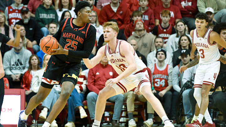 Jan 26, 2025; Bloomington, Indiana, USA; Maryland Terrapins center Derik Queen (25) goes to the basket against Indiana Hoosiers forward Luke Goode (10) during the first half at Simon Skjodt Assembly Hall. Mandatory Credit: Robert Goddin-Imagn Images