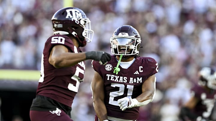 Sep 27, 2025; College Station, Texas, USA; Texas A&M Aggies linebacker Taurean York (21) celebrates with defensive end Dayon Hayes (50) against the Auburn Tigers during the fourth quarter at Kyle Field. Mandatory Credit: Maria Lysaker-Imagn Images 