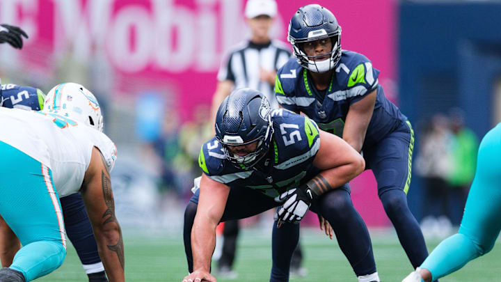 Sep 22, 2024; Seattle, Washington, USA; Seattle Seahawks center Connor Williams (57) prepares to snap the ball during the fourth quarter against the Miami Dolphins at Lumen Field. Mandatory Credit: Kevin Ng-Imagn Images