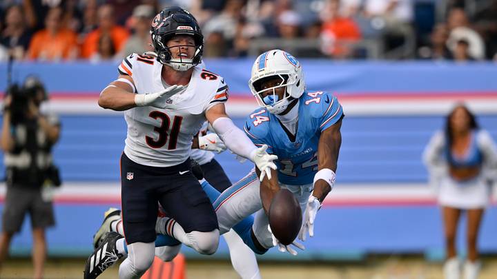Aug 29, 2026; Nashville, Tennessee, USA;  Chicago Bears safety Dillon Thieneman (31) breaks up a pass intended for Tennessee Titans wide receiver Carnell Tate (14) in the first quarter at Nissan Stadium.  Mandatory Credit: Steve Roberts-Imagn Images