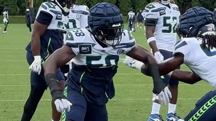 Seattle Seahawks outside linebacker Derick Hall rushes the passer during a drill at training camp. Seattle Seahawks outside linebacker Derick Hall rushes the passer during a drill at training camp.