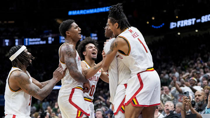 Maryland Terrapins center Derik Queen (25) celebrates with teammates after scoring the game-winning shot against the Colorado State Rams at Climate Pledge Arena.
