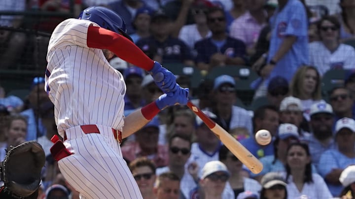 Aug 3, 2025; Chicago, Illinois, USA; Chicago Cubs outfielder Kyle Tucker (30) hits a single against the Baltimore Orioles during the seventh inning at Wrigley Field. Mandatory Credit: David Banks-Imagn Images