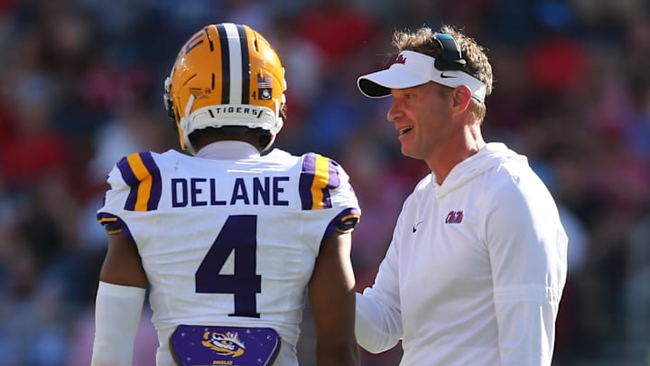 Ole Miss Rebels head coach Lane Kiffin talks with LSU Tigers cornerback Mansoor Delane during the second quarter at Vaught-Hemingway Stadium. 