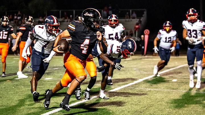Oviedo running back Johnnie Cobbs (4) breaks off a run against Lake Brantley in the Lions' 35-28 overtime victory on Sept. 4, 2026. Oviedo running back Johnnie Cobbs (4) breaks off a run against Lake Brantley in the Lions' 35-28 overtime victory on Sept. 4, 2026.