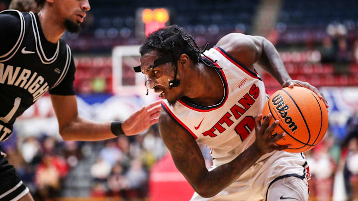 Detroit Mercy guard Antoine Davis (0) is defended by Wright State guard Trey Calvin (1) during the first half at Calihan Hall in Detroit on Saturday, Feb. 25, 2023. Detroit Mercy guard Antoine Davis (0) is defended by Wright State guard Trey Calvin (1) during the first half at Calihan Hall in Detroit on Saturday, Feb. 25, 2023.