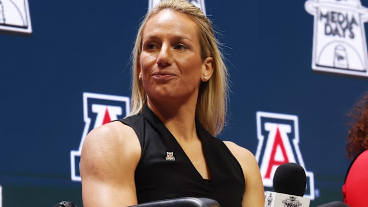Oct 21, 2025; Kansas City, MO, USA; Arizona head coach Becky Burke speaks to media during Big 12 Womenís Basketball Media Day at T-Mobile Center. Mandatory Credit: Sophia Scheller-Imagn Images