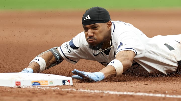 Tampa Bay Rays left fielder Chandler Simpson (14) slides into third after hitting a triple against the New York Yankees in the seventh inning at Tropicana Field. Tampa Bay Rays left fielder Chandler Simpson (14) slides into third after hitting a triple against the New York Yankees in the seventh inning at Tropicana Field.