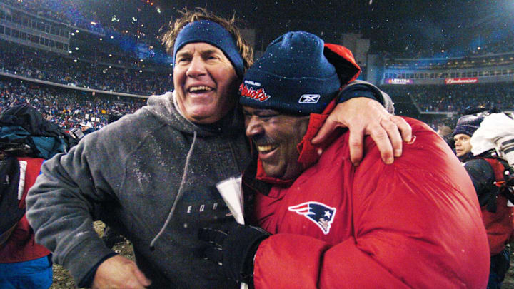 Bill Belichick celebrates with then-defensive coordinator Romeo Crennel after New England defeated the Indianapolis Colts to advance to the AFC Championship game.