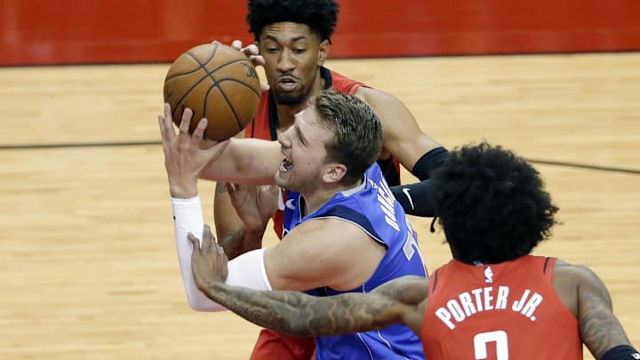 Apr 7, 2021; Houston, Texas, USA;  Dallas Mavericks guard Luka Doncic (77) is fouled as he drives to