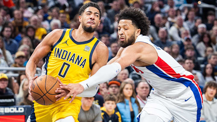 Nov 29, 2024; Indianapolis, Indiana, USA; Indiana Pacers guard Tyrese Haliburton (0) shoots the ball while Detroit Pistons guard Cade Cunningham (2) defends in the first half  at Gainbridge Fieldhouse. Mandatory Credit: Trevor Ruszkowski-Imagn Images