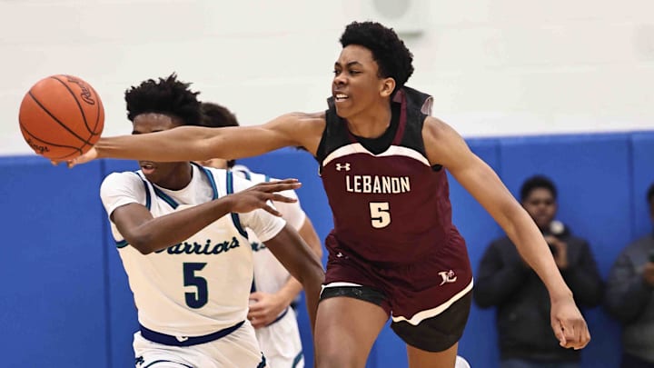 Lebanon forward Anthony Thompson (5) chases after a loose ball during their during their 50-61 loss to Winton Woods Friday, Jan. 5, 2024.