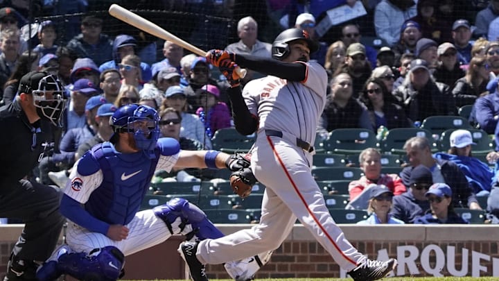 May 7, 2025; Chicago, Illinois, USA; San Francisco Giants first base LaMonte Wade Jr. (31) hits a one run double against the Chicago Cubs during the fourth inning at Wrigley Field. May 7, 2025; Chicago, Illinois, USA; San Francisco Giants first base LaMonte Wade Jr. (31) hits a one run double against the Chicago Cubs during the fourth inning at Wrigley Field.
