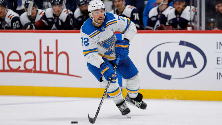 Dec 31, 2025; Denver, Colorado, USA; St. Louis Blues defenseman Justin Faulk (72) controls the puck in the third period against the Colorado Avalanche at Ball Arena. Mandatory Credit: Isaiah J. Downing-Imagn Images