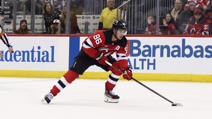 New Jersey Devils center Jack Hughes (86) skates with the puck. Mandatory Credit: Ed Mulholland-Imagn Images