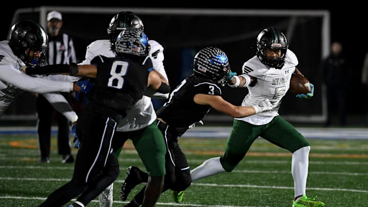 Decatur's Gavin Solito (3) tackles Milford Mill's Damon Ferguson (5) Friday, Nov. 24, 2023, in the 2A State Semifinal in Berlin, Maryland. Decatur defeated Milford Mill 35-34. Decatur's Gavin Solito (3) tackles Milford Mill's Damon Ferguson (5) Friday, Nov. 24, 2023, in the 2A State Semifinal in Berlin, Maryland. Decatur defeated Milford Mill 35-34.