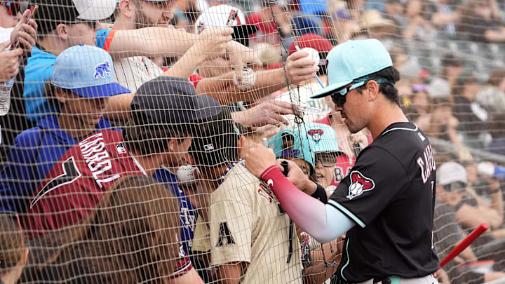 Arizona Diamondbacks outfielder Corbin Carroll signs autographs before playing the Athletics during a spring training game at Hohokam Stadium on March 12, 2025, in Mesa. Arizona Diamondbacks outfielder Corbin Carroll signs autographs before playing the Athletics during a spring training game at Hohokam Stadium on March 12, 2025, in Mesa.