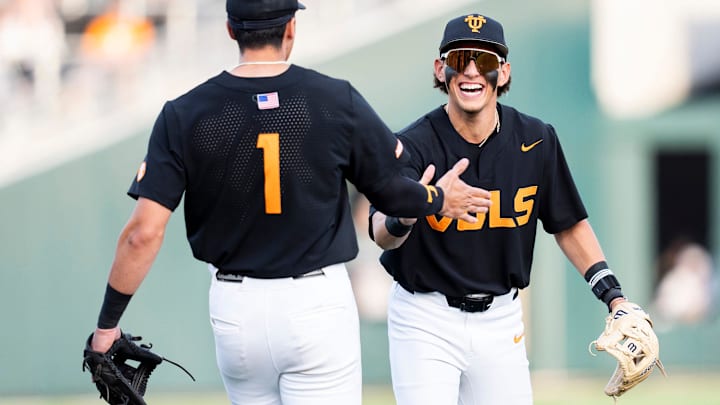 Tennessee's Dean Curley (1) and Tennessee's Manny Marin (4) celebrate a call in Tennessee's favor during a college baseball game between Tennessee and Vanderbilt at Lindsey Nelson Stadium in Knoxville, Tenn., on May 9, 2025.